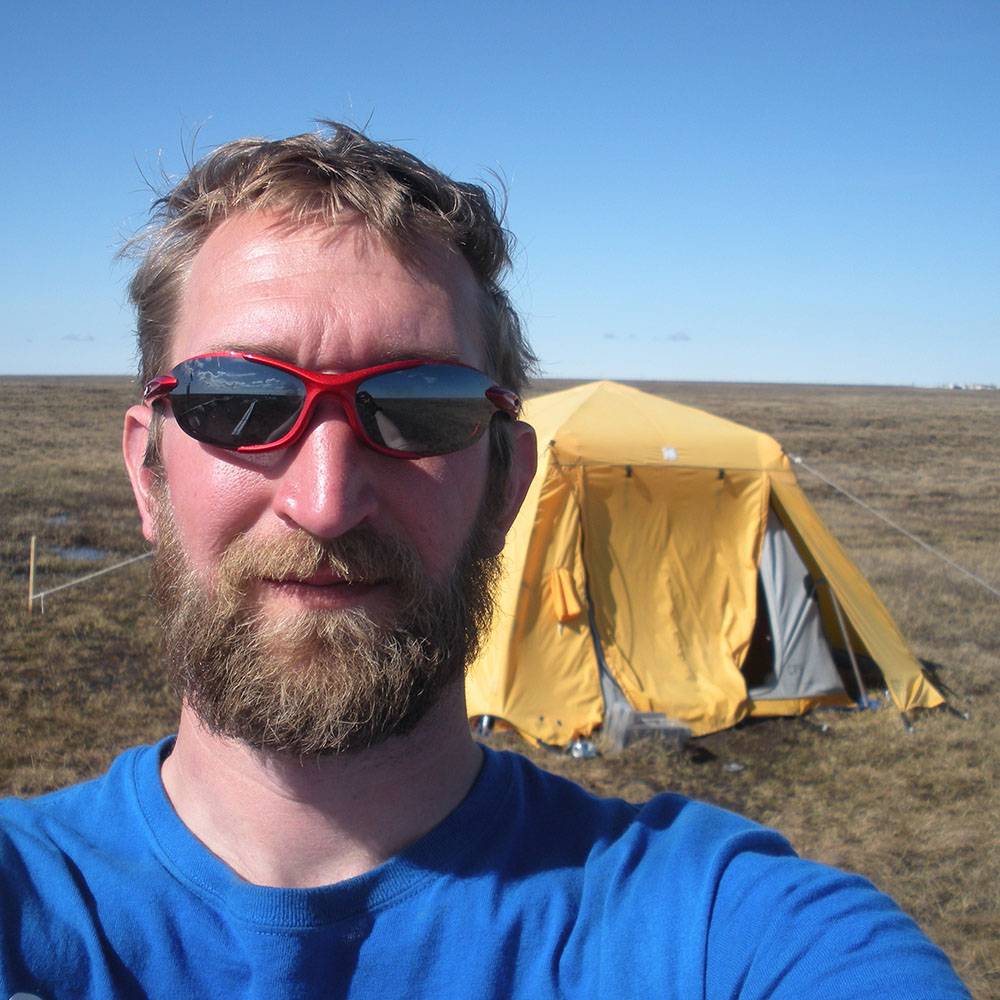 AJ snaps a photo of himself wearing sunglasses.